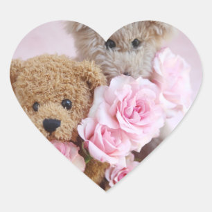 dois ursos peludos segurando rosas com autocolante