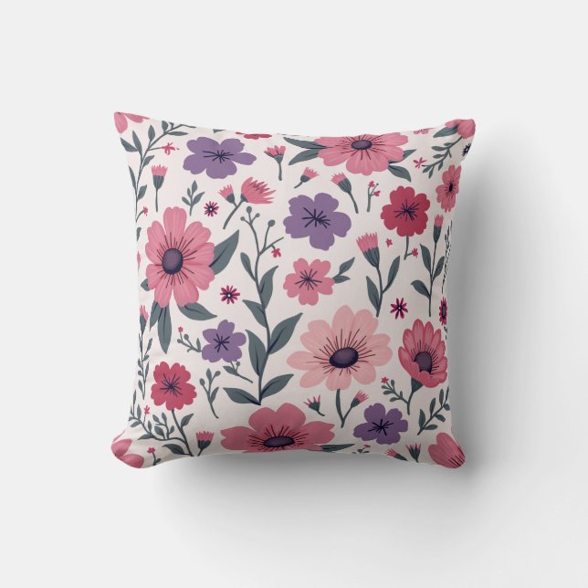 É uma almofada misturada com flores rosa e roxo. (Frente)