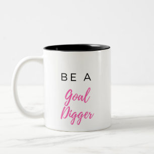 Em Dois Tons Seja uma caneca de café do escavador do objetivo
