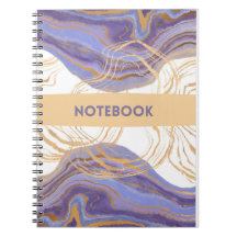 caderno roxo, dourado e branco