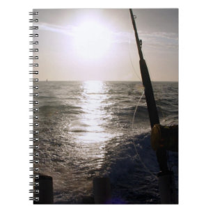 Espiral Pesca no caderno do por do sol