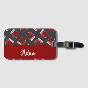 Etiqueta De Bagagem Maroon acordion sobre cinzas