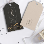 Etiqueta Para Presente Monograma Floral Dourado Luxurioso Obrigado Casame<br><div class="desc">Expresse a sua sincera gratidão com o nosso "Monograma Floral Dourado Luxurioso, Obrigado por Termos Etiquetas de Presente de Casamento." Estas elegantes etiquetas favoritas ao casamento apresentam um monograma personalizado com as vossas iniciais, rodeadas por delicados sotaques florais de ouro. A tipografia minimalista e a paleta de cores ricas, dominadas...</div>