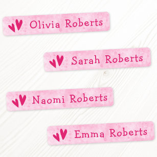 Etiquetas Corações cor-de-rosa e vestuário de tecido feminin