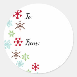 Etiquetas do presente com os flocos de neve em