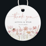 Etiquetas Para Lembrancinhas Earthy Neutral Wildflower Floral Wedding<br><div class="desc">Add a heartfelt finishing touch to your wedding favors with these watercolor wildflower thank you tags. Featuring a meadow of hand-painted blooms in romantic neutral tones with elegant script that reads “thank you, ” this round tag is personalized with your names and wedding date. Perfect for attaching to favor bags,...</div>
