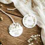 Etiquetas Para Lembrancinhas White Floral Greenery Bridal Shower Round<br><div class="desc">Soft and refined, these white watercolor floral round bridal shower thank you tags add a beautiful finishing touch to your celebration. The front features delicate white flowers with soft green sage foliage and “thank you” in elegant script, personalized with the future bride’s name. The back showcases a matching watercolor floral...</div>