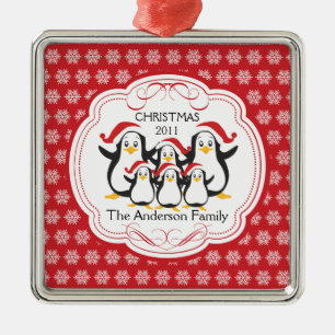 Família bonito dos pinguins dos enfeites de natal