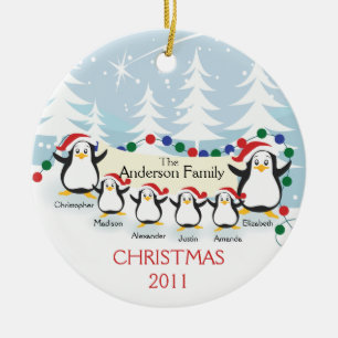 Família bonito dos pinguins dos enfeites de natal