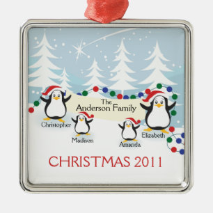 Família bonito dos pinguins dos enfeites de natal