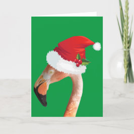 Festividades Flamingo rosa em um cartão de Natal com chapéu ver