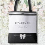 Flower Girl Gift | Minimalist Luxury Tote Bag<br><div class="desc">Even the smallest member of the bridal party deserves a "high-end" gift! This Flower Girl tote bag features the same elegant typography and silver accents as the adult versions, for a sweet yet sophisticated look. Perfect for holding petals, snacks, or activity books. The durable design and personalized name make it...</div>