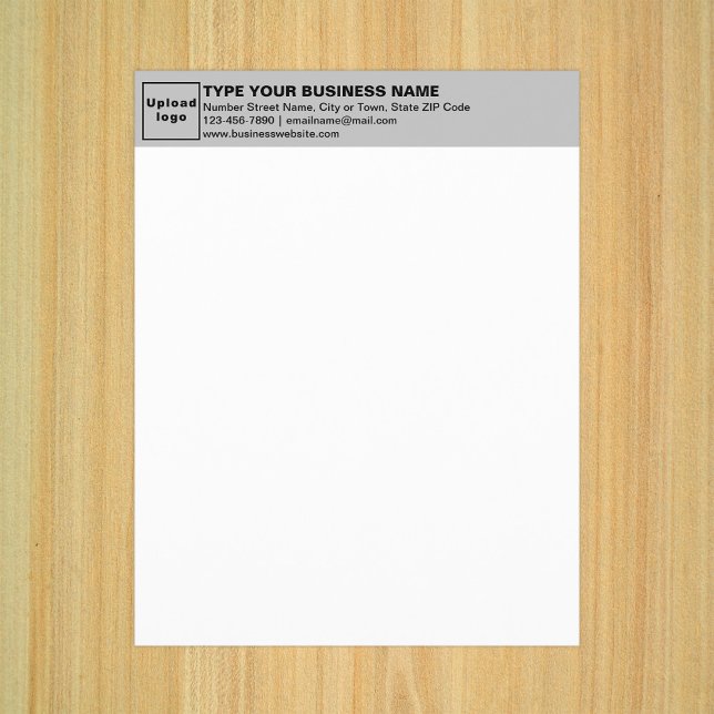 Folha de Cinza comercial no papel (Business gray letterhead on paper sheet.)