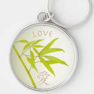 Folhas do bambu e chaveiro do símbolo do amor