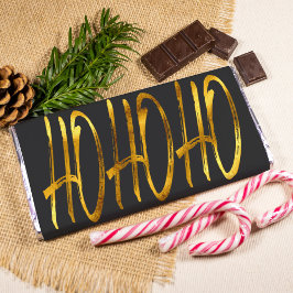 Foto invólucro de chocolate preto e ouro de natal moder
