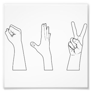 Foto Mãos de papel das tesouras da rocha