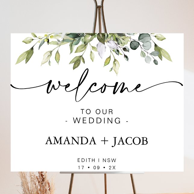 Foto Sinal de Boas-vindas do Casamento da Folhagem Verd (Foliage of greenery wedding welcome sign featuring a modern calligraphy heading with swash tails.)