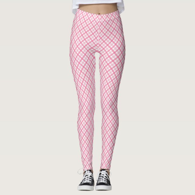 Front and back views of pink plaid leggings worn  (Frente)