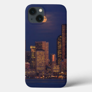Full moon rising over downtown Seattle skyline