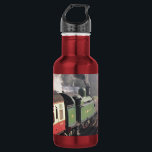 GARRAFA COMBOIOS DE VAPOR<br><div class="desc">Um comboio a vapor e as carruagems de uma era passada,  que foram restaurados de forma magnífica,  deixando a estação de comboios e o maquinista entregando a chave antes de ser autorizado a prosseguir ao longo do caminho de ferro. Inglaterra Reino Unido.</div>