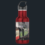 GARRAFA COMBOIOS DE VAPOR<br><div class="desc">Um comboio a vapor e as carruagems de uma era passada,  que foram restaurados de forma magnífica,  deixando a estação de comboios e o maquinista entregando a chave antes de ser autorizado a prosseguir ao longo do caminho de ferro. Inglaterra Reino Unido.</div>