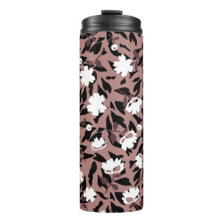 Garrafa Térmica Padrão floral sobre fundo leopardo.