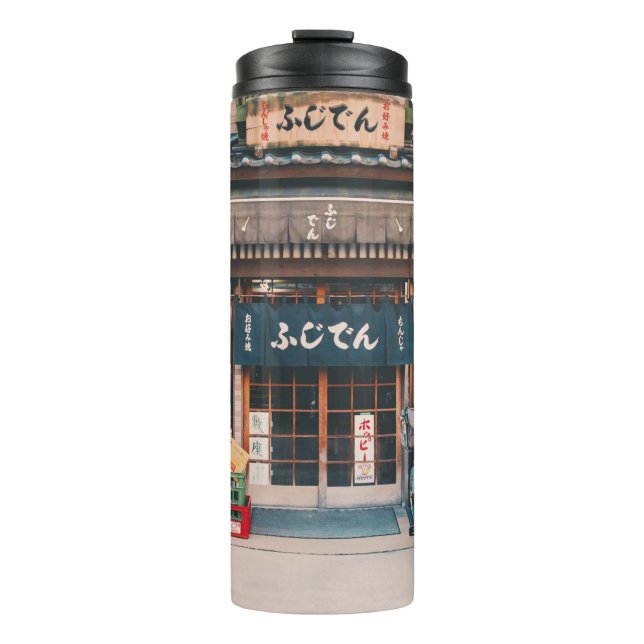 GARRAFA TÉRMICA  TRÊS BICICLETAS ESTACIONADAS NA FRENTE DA CONSTRUÇ (Frente)