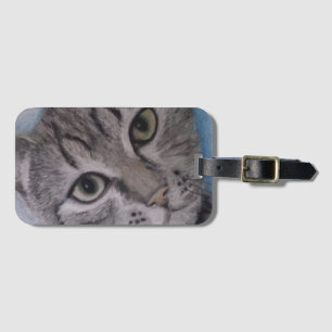 Gato numa etiqueta de bagagem