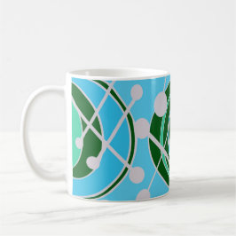 Geoformas em verde e azul com caneca branca