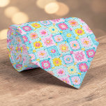 Gravata 70s Granny Square Crochet Necktie<br><div class="desc">This unique necktie features a vibrant 70s-inspired design, crafted with intricate granny square crochet. It's a bold and stylish statement piece, perfect for adding a touch of retro charm and handmade artistry to any outfit. The warm, inviting colors and textured pattern make it a conversation starter, suitable for both casual...</div>