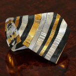 Gravata Striped Gold, Black, Silver Necktie<br><div class="desc">This stylish necktie features a classic striped pattern in rich gold, sophisticated black, and elegant silver. Perfect for adding a touch of modern flair to any outfit, whether it's for a business meeting, a special event, or simply to elevate your everyday look. The high-quality fabric ensures a comfortable and durable...</div>