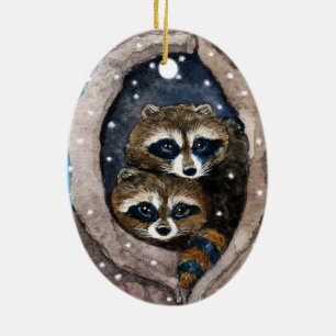 Guaxinins bonitos e enfeites de natal da neve
