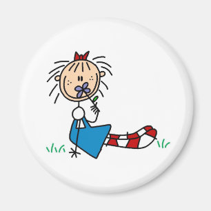 Íman Annie que encontra-se na grama com ímã da flor