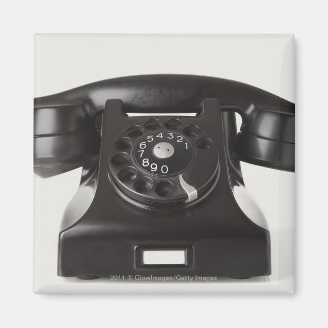 Íman Aproximação de um telefone rotativo (Frente)