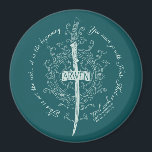 Íman ARWEN™ Elven Sword Quote<br><div class="desc">Honor the strength and grace of Arwen™ with this striking Lord of the Rings™ design inspired by the Elves. Centered around an elegant Elven sword framed by intricate, flowing vinework, the artwork beautifully reflects her courage, devotion, and timeless spirit. The circular quote, “This is not the end… it is the...</div>