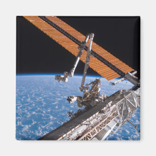 Íman As asas do painel de Canadarm2 e da disposição