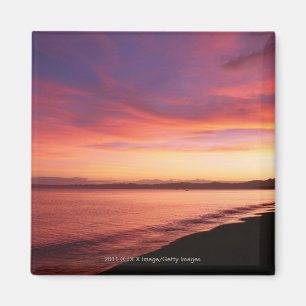 Íman Belo pôr do sol na praia