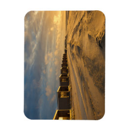 Íman Cabinas de praia no pôr do sol na costa neerlandes