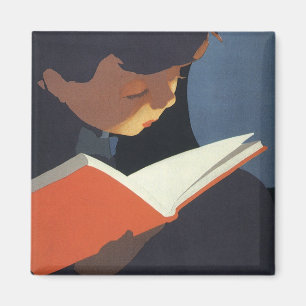 Íman Criança do vintage que lê um livro da biblioteca