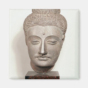 Íman Dirija de uma estátua do Buddha, de