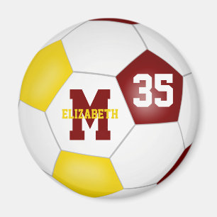 Íman douradas do maroon jogadoras do time de futebol