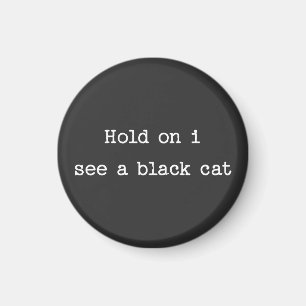 Íman Espera, vejo um gato negro