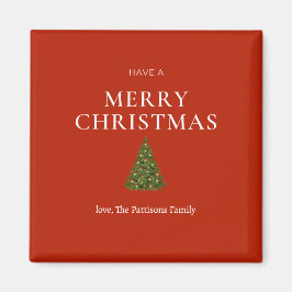 Íman Feliz Natal saudando a árvore de costume vermelho