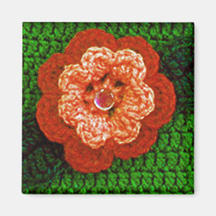 Íman Flor alaranjada com impressão verde do Crochet da