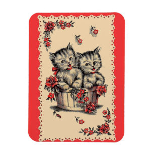 Íman gatinhos adoráveis num cesto de flores