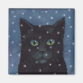 Íman gato negro na neve de inverno
