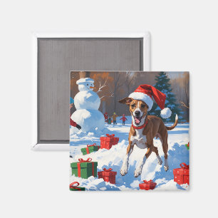 Íman Greyhound Correndo na Neve com Chapéu de Natal