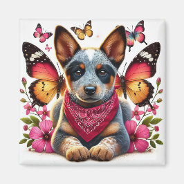 Íman Heeler Puppy cercado por borboletas e flores