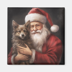 Íman Kelpie australiano com Papai Noel no Natal