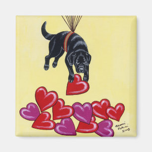 Íman Labrador preto que recolhe o AMOR